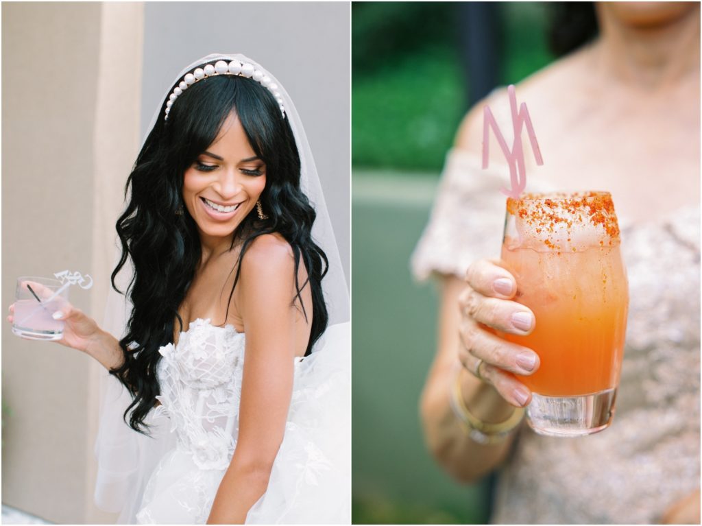 bride holding cocktail with custom drink stirrers