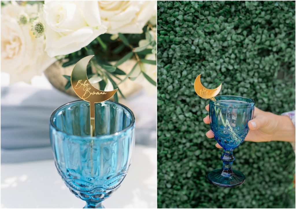 Blue goblets with custom gold moon shaped drink stirrer for moon and stars baby shower